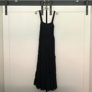 A Free People maxi black dress with lace patterns.